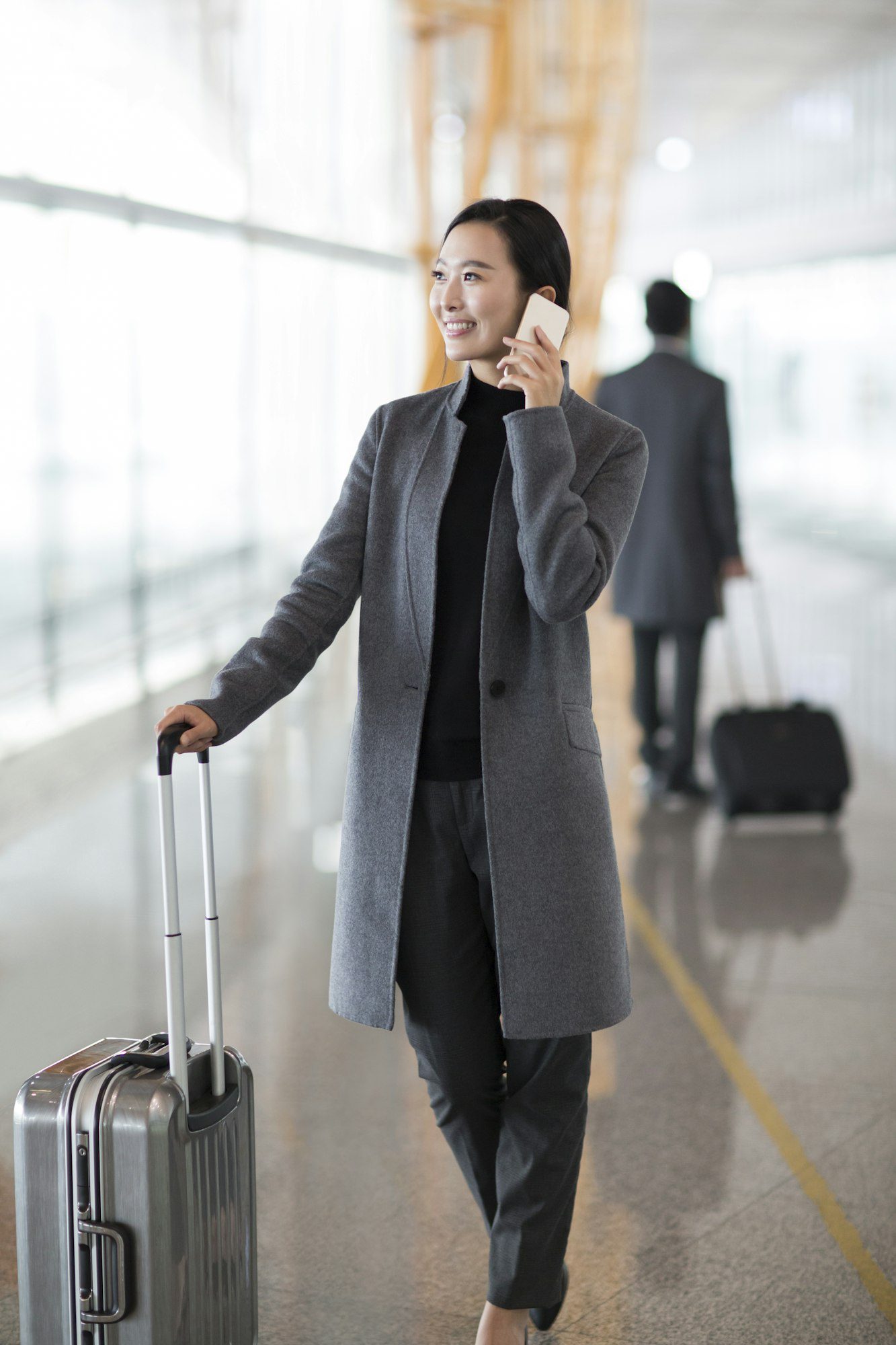 Businesswoman talking on the phone at the airport